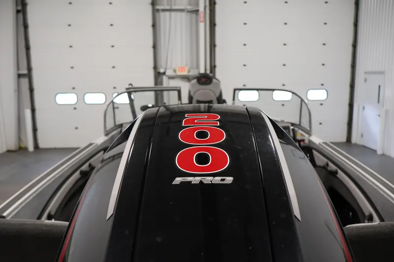 Slide: The Image of 2022 Ranger 1880MS boat engine with "200 Pro" label in a garage setting. - 43