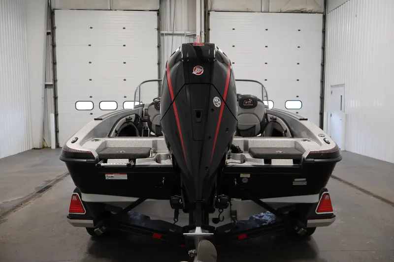 Slide: The Image of 2022 Ranger 1880MS boat in a garage, rear view with motor. - 5