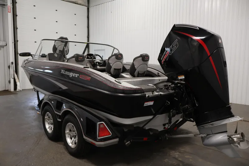 Slide: The Image of 2022 Ranger 1880MS boat with powerful outboard motor in a showroom setting. - 6