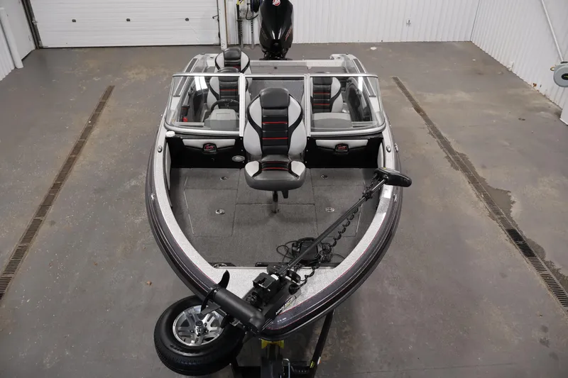 Slide: The Image of 2022 Ranger 1880MS boat in a garage, featuring sleek design and modern seating. - 8