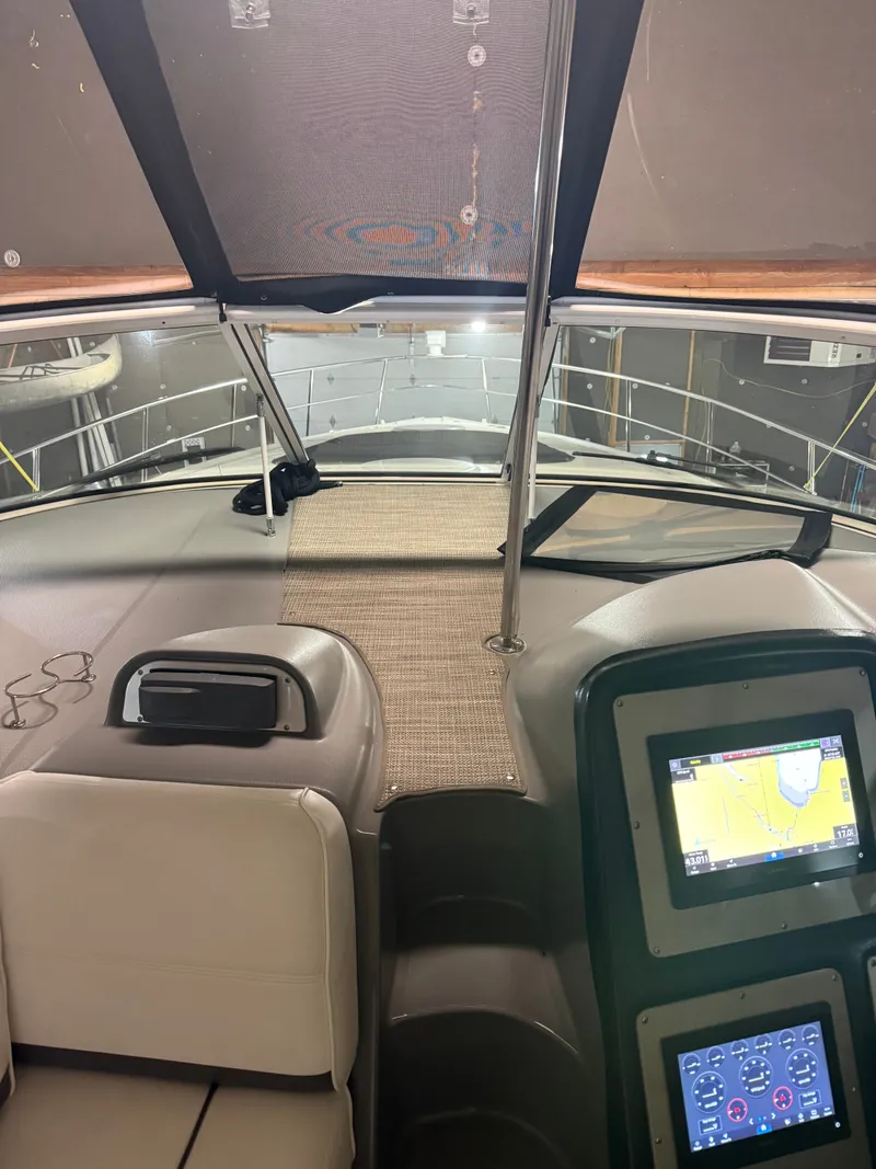 Slide: The Image of Interior view of 2006 Cruisers Yachts 420 Express with navigation system. - 11