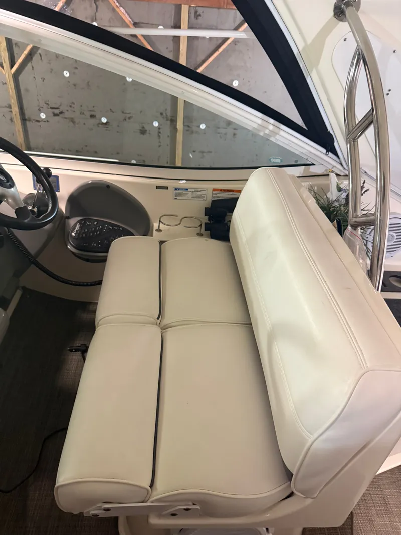 Slide: The Image of Interior of a 2006 Cruisers Yachts 420 Express with beige seating. - 12