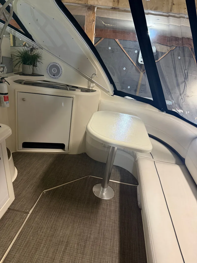 Slide: The Image of Interior of 2006 Cruisers Yachts 420 Express with seating and table. - 13