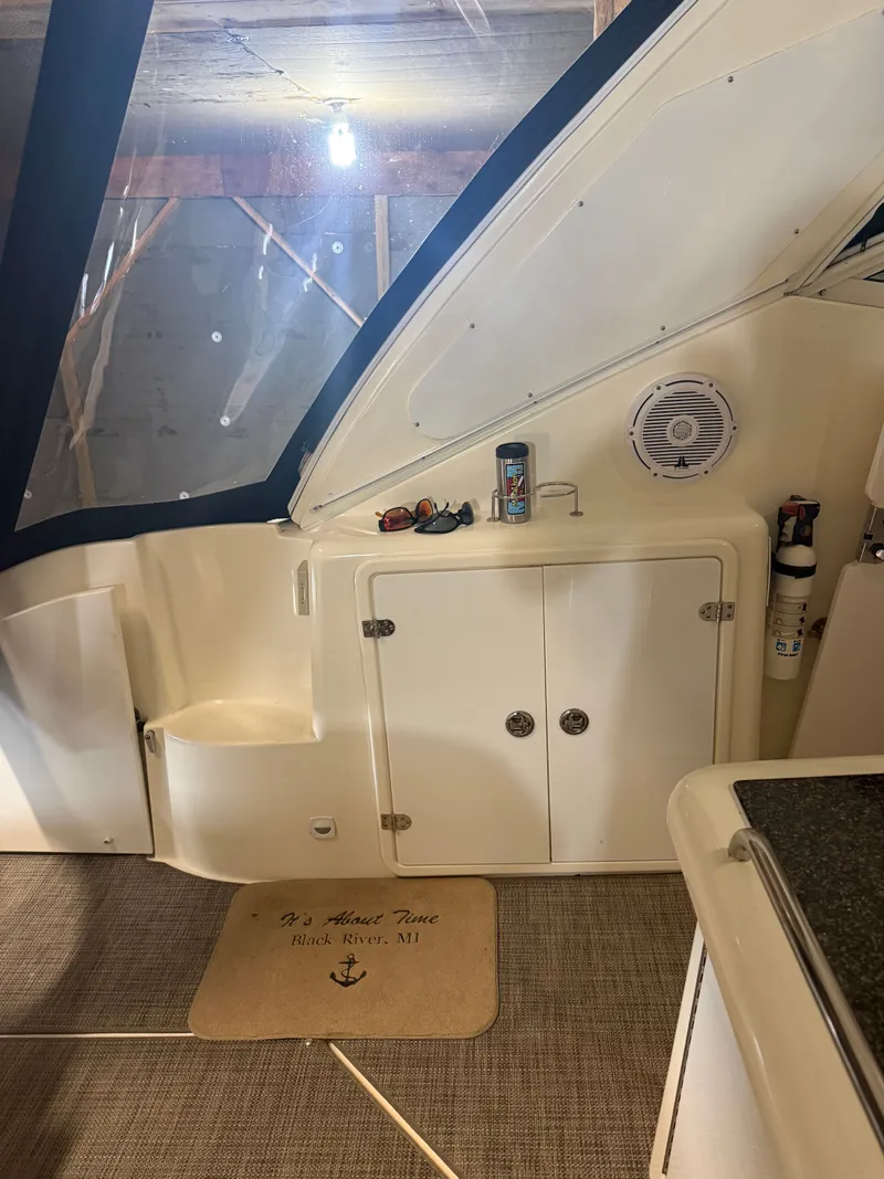 Slide: The Image of Interior of a 2006 Cruisers Yachts 420 Express with cabinets and carpet. - 15