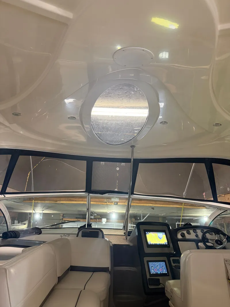 Slide: The Image of Interior of a 2006 Cruisers Yachts 420 Express with helm console. - 16