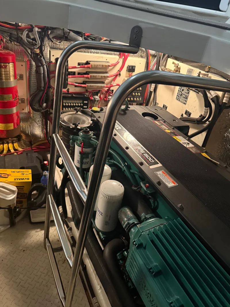 Slide: The Image of Engine room of 2006 Cruisers Yachts 420 Express with engine and fire extinguisher. - 19