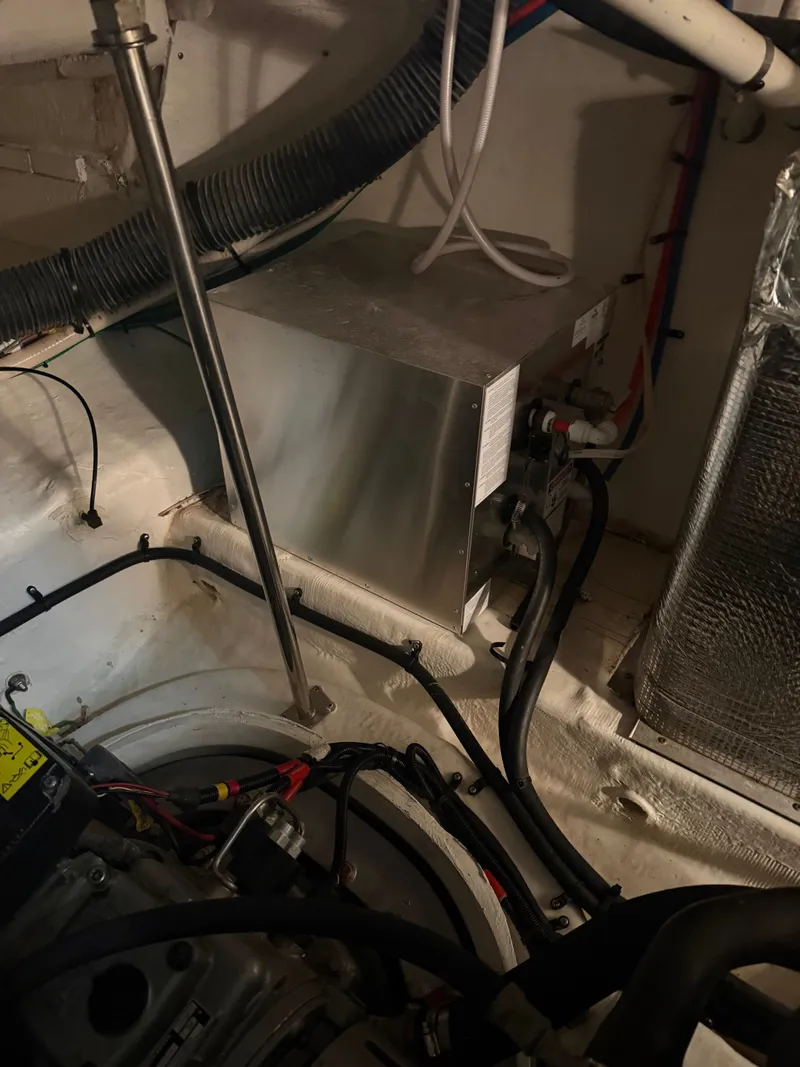 Slide: The Image of Engine room of 2006 Cruisers Yachts 420 Express with technical components. - 21