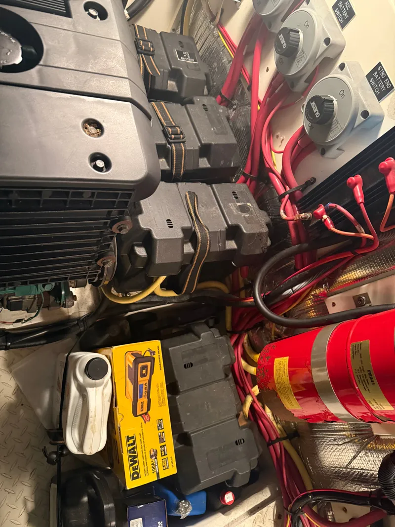 Slide: The Image of Engine room of 2006 Cruisers Yachts 420 Express with batteries and cables. - 22