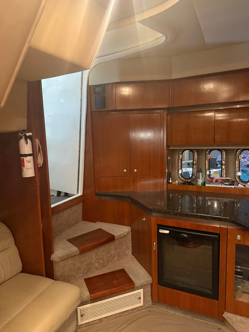 Slide: The Image of Interior of a 2006 Cruisers Yachts 420 Express with wooden cabinetry. - 4