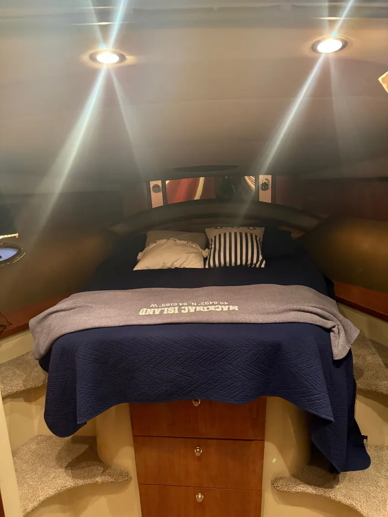 Slide: The Image of Interior of a 2006 Cruisers Yachts 420 Express with cozy bed. - 5