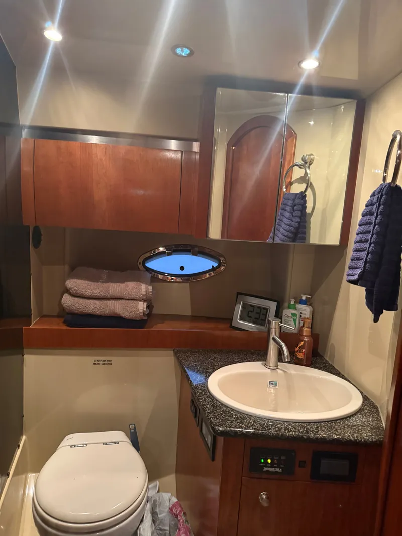 Slide: The Image of Luxurious bathroom in a 2006 Cruisers Yachts 420 Express. - 6