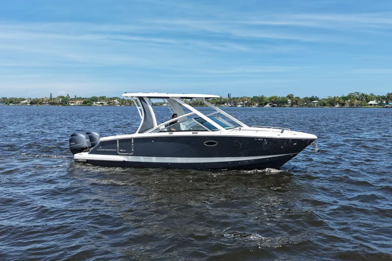 The Image of 2022 Chaparral 280 OSX boat cruising on a sunny day in open water. - 0