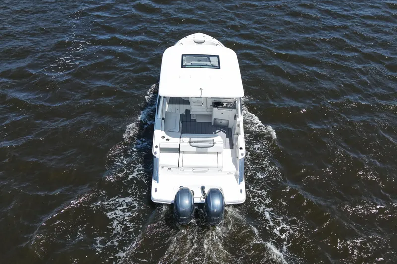 Slide: The Image of Aerial view of 2022 Chaparral 280 OSX on the water. - 18