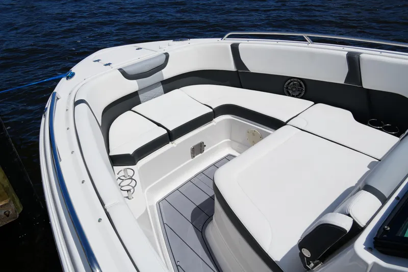 Slide: The Image of 2022 Chaparral 280 OSX boat interior with white seating and sleek design. - 19