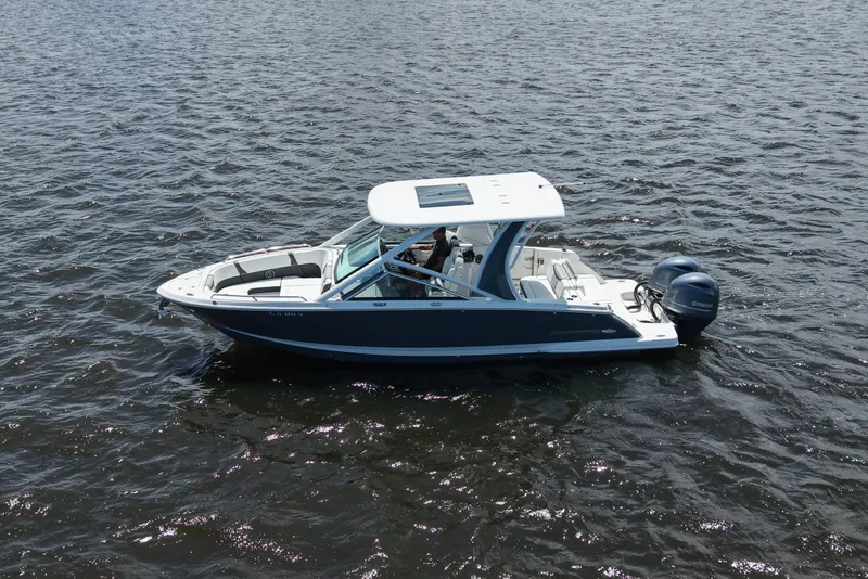 Slide: The Image of 2022 Chaparral 280 OSX boat cruising on open water. - 4