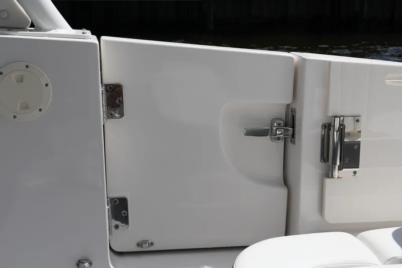 Slide: The Image of 2022 Chaparral 280 OSX boat door with stainless steel hinges and latch. - 42