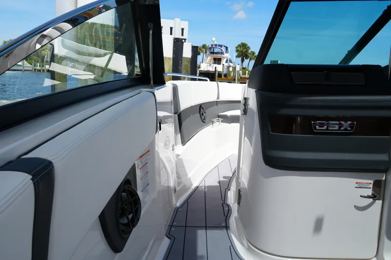 Slide: The Image of 2022 Chaparral 280 OSX boat interior with sleek seating and modern design. - 45