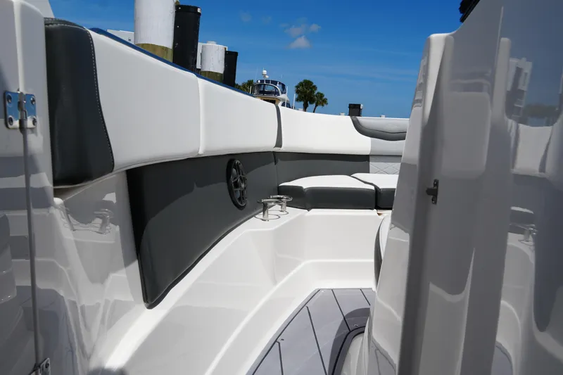 Slide: The Image of 2022 Chaparral 280 OSX boat interior with sleek seating and modern design. - 46