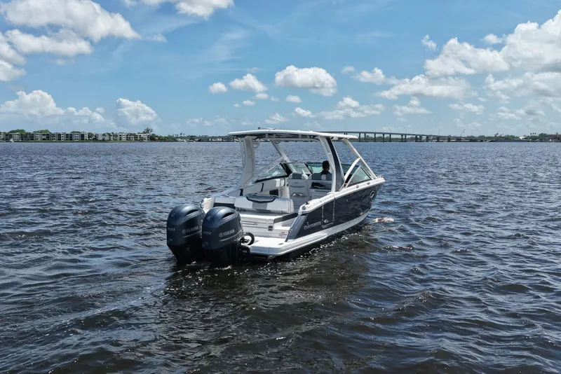 Slide: The Image of 2022 Chaparral 280 OSX boat cruising on a sunny day with clear skies. - 8