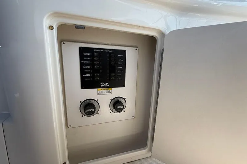 Slide: The Image of Electrical panel inside a 2007 Sea Ray 300 Sundancer boat compartment. - 11