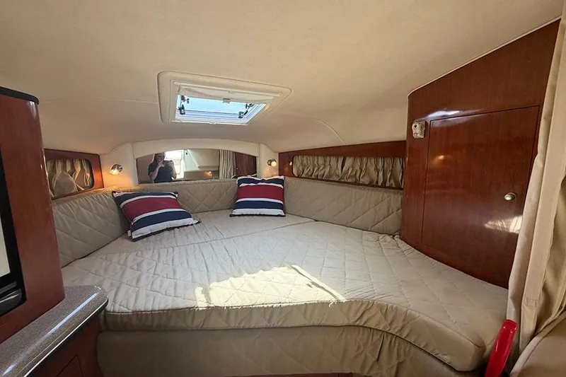 Slide: The Image of Interior cabin of 2007 Sea Ray 300 Sundancer with cozy bed and skylight. - 21