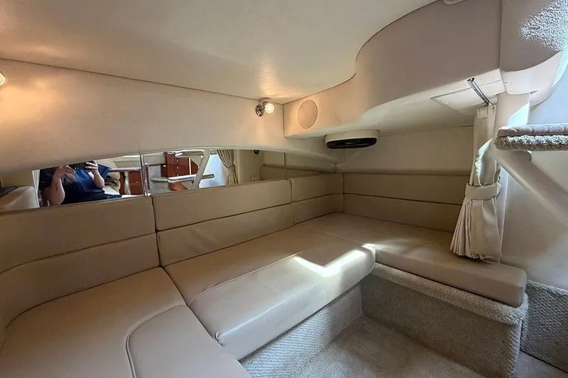 Slide: The Image of Interior of 2007 Sea Ray 300 Sundancer with beige seating and soft lighting. - 32
