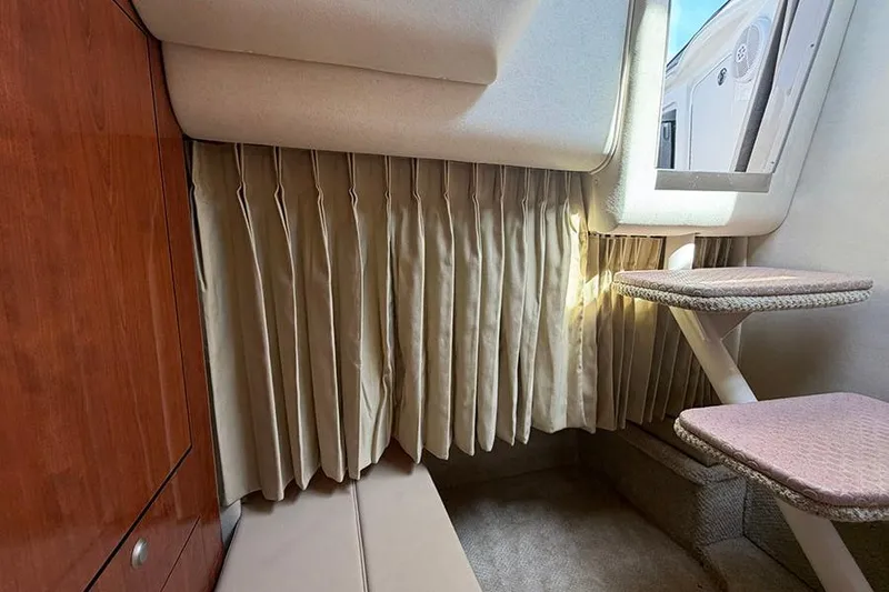 Slide: The Image of Interior cabin of 2007 Sea Ray 300 Sundancer with window and steps. - 34