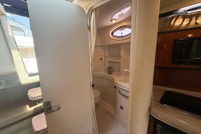 Slide: The Image of 2007 Sea Ray 300 Sundancer cabin interior with bathroom and kitchenette. - 36