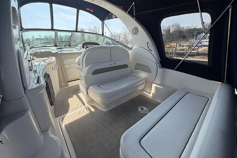 Slide: The Image of Interior of a 2007 Sea Ray 300 Sundancer boat with seating and helm. - 5