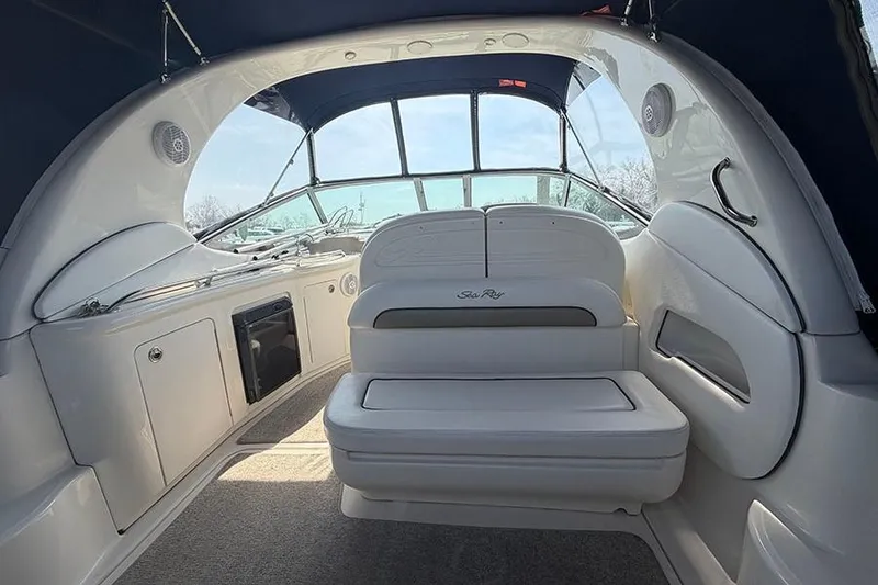 Slide: The Image of 2007 Sea Ray 300 Sundancer interior with seating and helm, showcasing luxury design. - 8