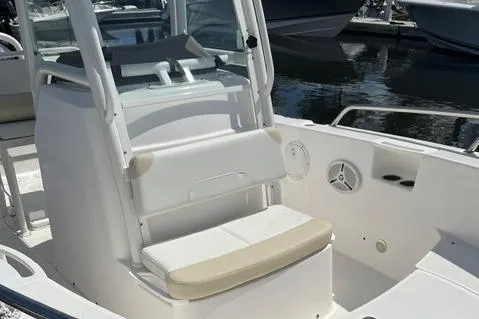 Slide: The Image of 2011 Everglades 230 Center Console boat interior with seating and console details. - 12
