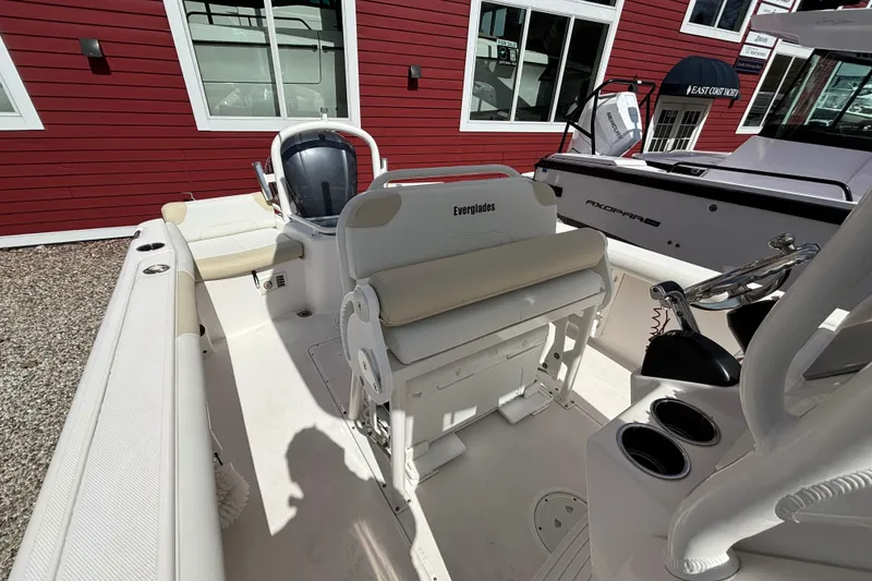Slide: The Image of 2011 Everglades 230 Center Console boat interior with seating and steering wheel. - 18