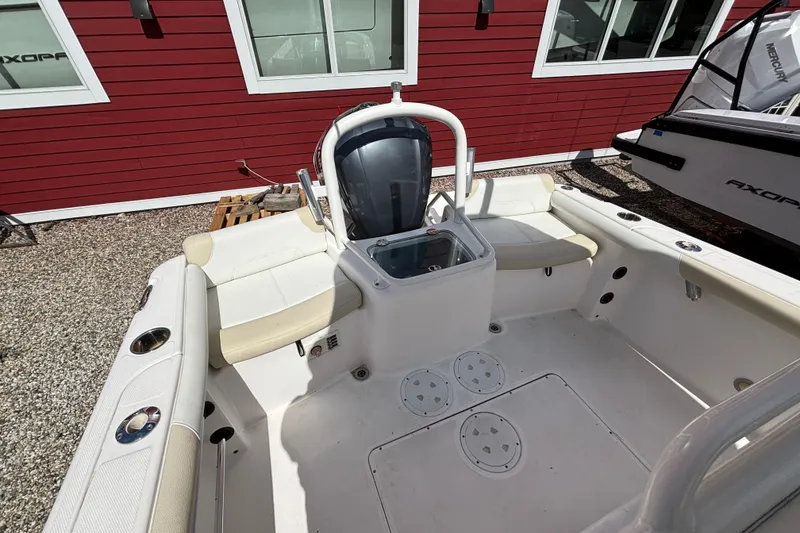 Slide: The Image of 2011 Everglades 230 Center Console boat interior with seating and storage compartments. - 27