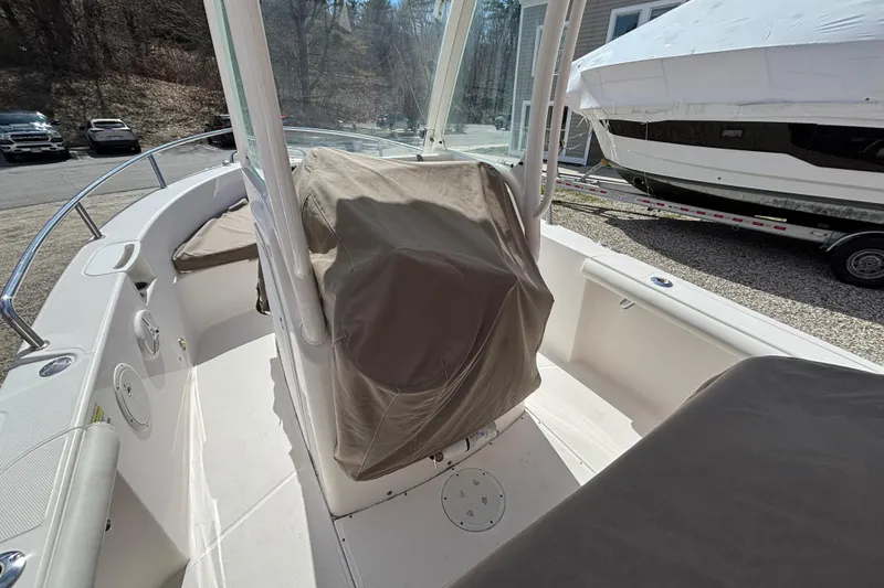 Slide: The Image of 2011 Everglades 230 Center Console boat interior with covered seating and console. - 31
