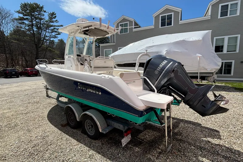 Slide: The Image of 2011 Everglades 230 Center Console boat with Yamaha outboard, parked on a trailer. - 5