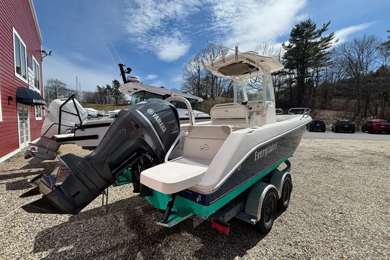 Slide: The Image of 2011 Everglades 230 Center Console boat with Yamaha engine on trailer, parked outdoors. - 9