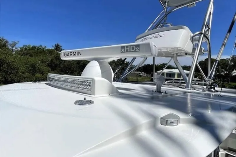 Slide: The Image of 2022 SeaVee 390Z boat with Garmin xHD2 radar on deck under clear blue sky. - 4