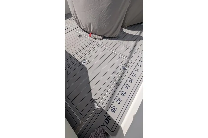 Slide: The Image of 2022 SeaVee 390Z boat deck with measurement markings and covered equipment. - 6