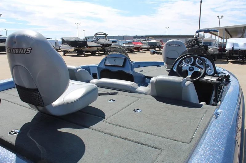 Slide: The Image of 2006 Stratos 275 Pro XL boat interior with steering wheel and seating. - 11