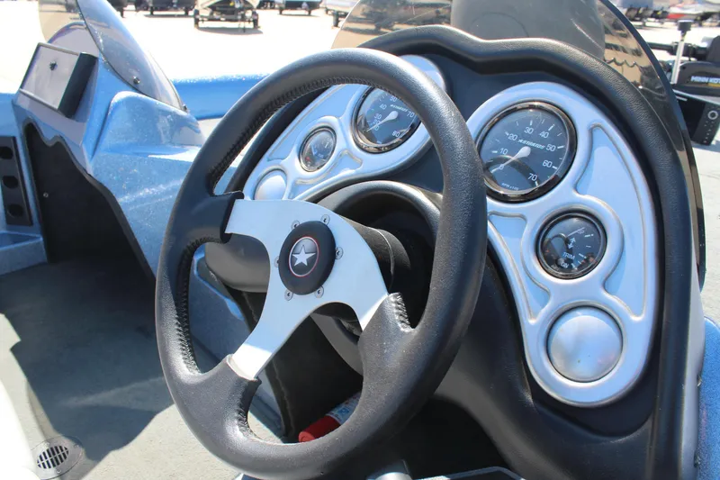 Slide: The Image of Steering wheel and dashboard of 2006 Stratos 275 Pro XL boat. - 12