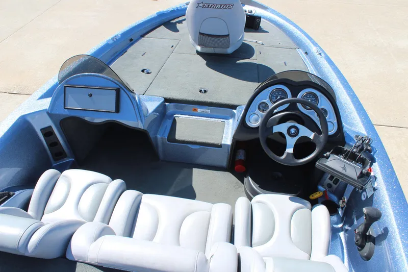 Slide: The Image of 2006 Stratos 275 Pro XL boat interior with steering wheel and seating. - 16