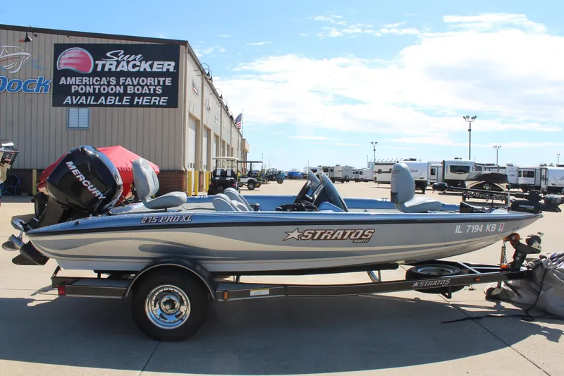 Slide: The Image of 2006 Stratos 275 Pro XL boat with Mercury engine on trailer, parked outside dealership. - 3