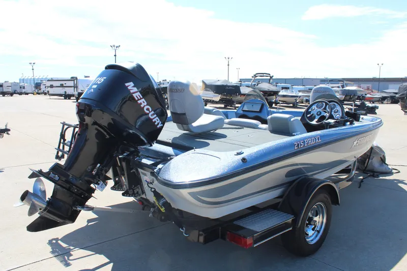 Slide: The Image of 2006 Stratos 275 Pro XL boat with Mercury engine on trailer in outdoor lot. - 4