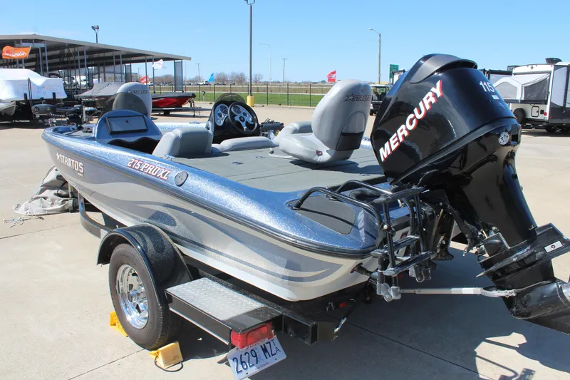 Slide: The Image of 2006 Stratos 275 Pro XL boat with Mercury engine, parked on a trailer. - 6