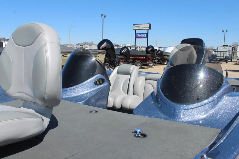 Slide: The Image of 2006 Stratos 275 Pro XL boat with dual consoles and gray seating, displayed outdoors. - 7