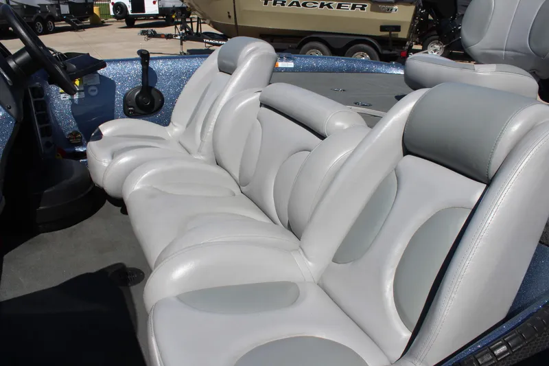 Slide: The Image of 2006 Stratos 275 Pro XL boat interior with gray leather seats and steering console. - 8