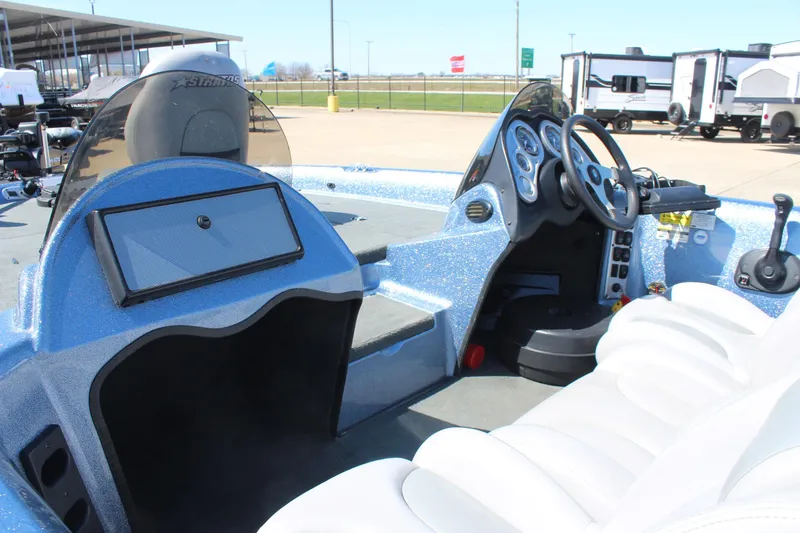 Slide: The Image of 2006 Stratos 275 Pro XL boat interior with steering wheel and dashboard controls. - 9