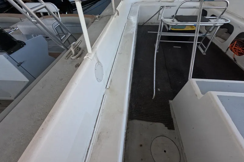 Slide: The Image of 1979 Willard Marine 50 Utility Launch interior with seating and railing. - 11