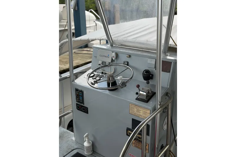 Slide: The Image of Control panel of a 1979 Willard Marine 50 Utility Launch with Garmin equipment. - 15