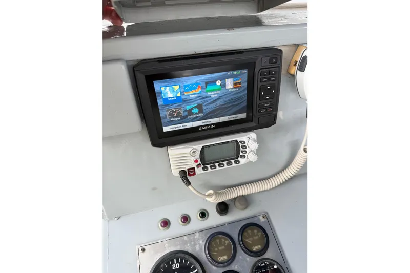 Slide: The Image of Control panel of a 1979 Willard Marine 50 Utility Launch with Garmin navigation system. - 17